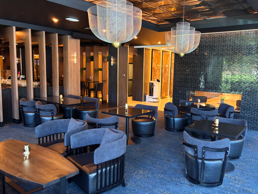 Exchange Restaurant and Bar Lounge Side with luxurious, soft seating, fireplace and wrap around windows